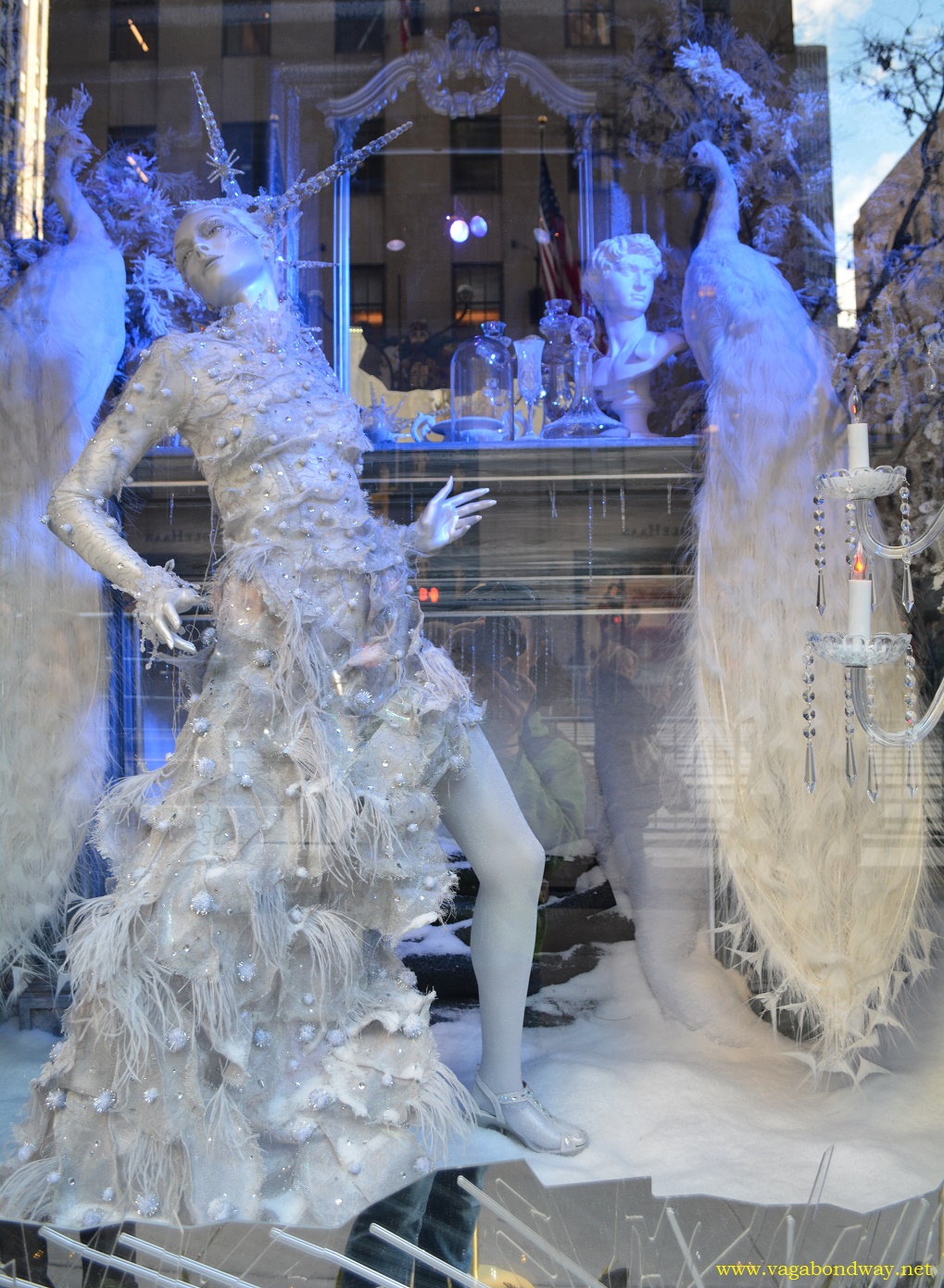 White dress lady storefront New York City